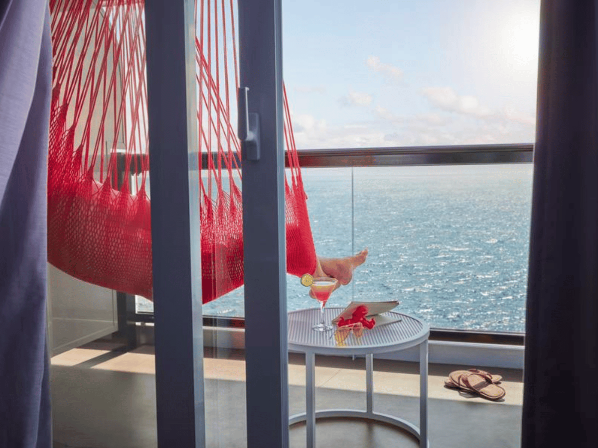 Your Sea Terrace cabin onboard the Sober Cruise 2027 with signature red hammock and ocean views